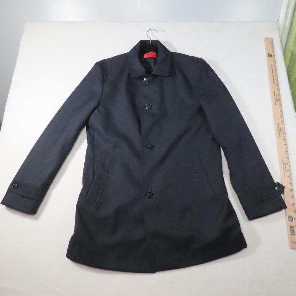 The HUGO Hugo Boss Mens Dark Navy Overcoat is a stylish and versatile mid-length